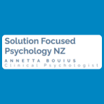 Solution Focused Psychology NZ logo, featuring the practice name in blue above “Annetta Bouius” and “Clinical Psychologist” in widely spaced blue lettering, on a white background.