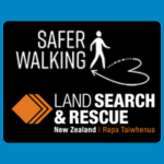 Safer Walking New Zealand Land Search & Rescue logo with a walking figure and path graphic above white text reading “SAFER WALKING,” and smaller text reading “LAND SEARCH & RESCUE New Zealand | Rapa Tautīwhenua” on a black background, with an orange diamond shape at left.