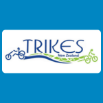 Trikes New Zealand logo with blue text reading “TRIKES New Zealand” and small blue and green tricycle icons on a white background.