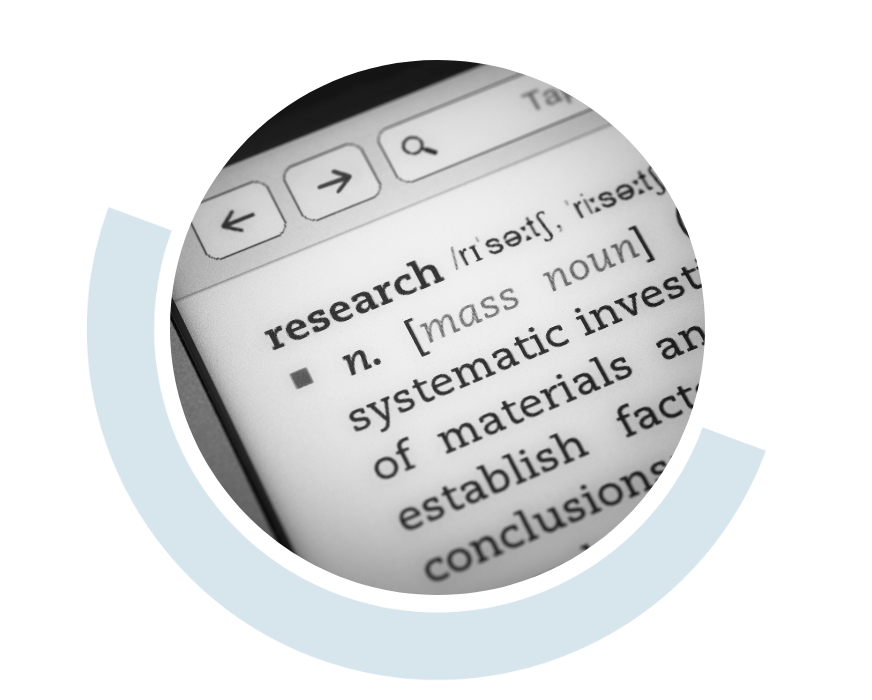 Website header graphic with a pale background and curved light blue accents, featuring a circular close-up of the word “research” and its dictionary definition displayed on a computer screen.