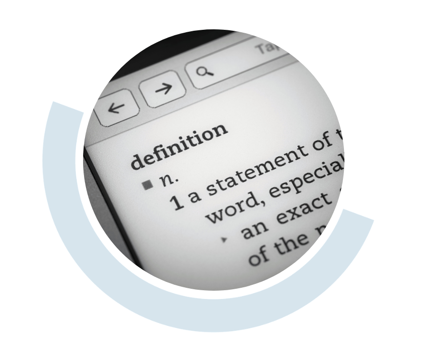 Website header graphic with a pale background and curved light blue accents, featuring a circular close-up of the word “definition” and its dictionary entry displayed on a computer screen.